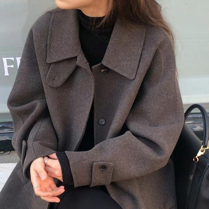 Manteau court en laine noir - élégant et sophistiqué