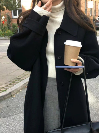 Manteau court en laine noir - élégant et sophistiqué